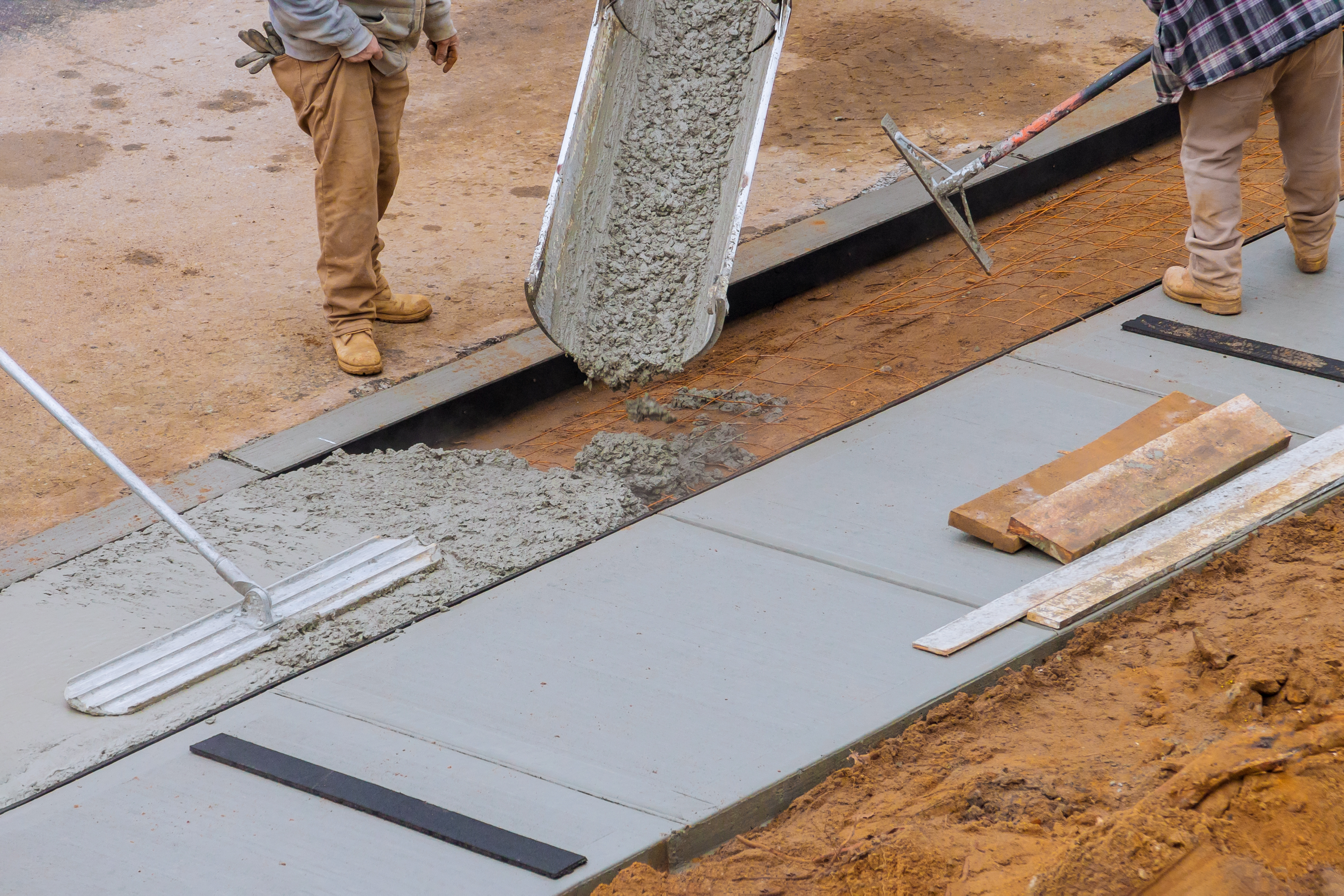 Concrete crew finishing a commercial slab