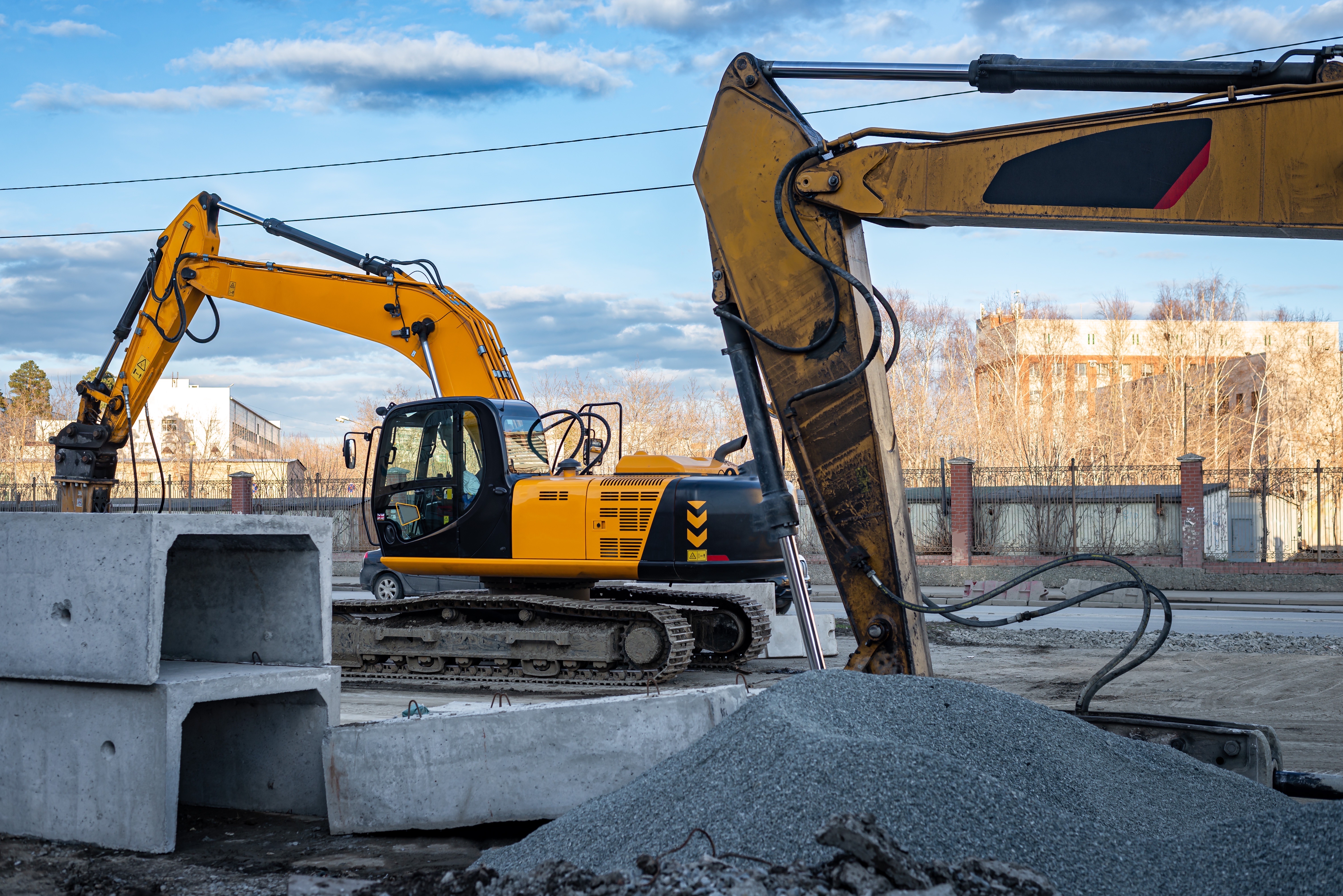 Excavators performing mass excavation on a Michigan site